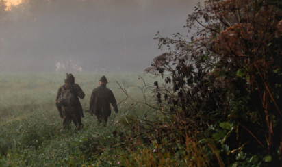Two Hunters | © adobe.stock - okyela Morning autumn landscape with hunters walking in the fog along the edge of the forest. | © adobe.stock - okyela